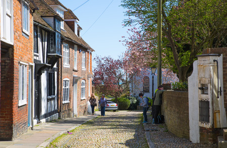 RYE, UK - 1 MAY, 2016: Old street of Rye town with periodic buildings. Mermaid Street showing typically steep slope and cobbled surfaceのeditorial素材