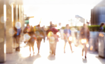 Business people walking in the City, blurred image with lights reflection. Business and modern life conceptの写真素材