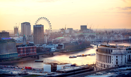LONDON, UK - DECEMBER 19, 2016: London at sunset, view at the Westminster side of the city, River Thames and London bridge sun reflectionのeditorial素材