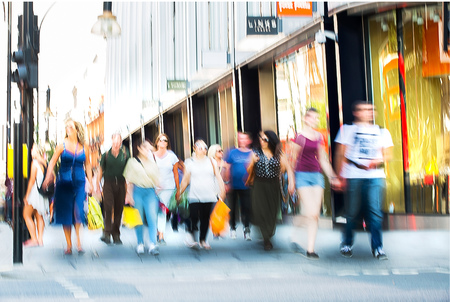 Blurred image of walking people. Londoners and tourists walking in Oxford street, one of the main shopping destination of Londonのeditorial素材