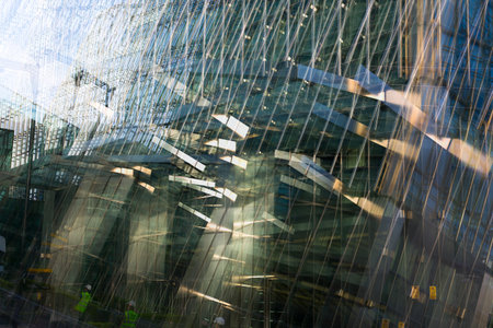 Multiple exposure effect image. Canary wharf office buildings view from the dock.
