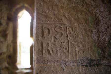 Window of fortification turret with old graffiti, Bodiam Castle 14th-century. England, UKのeditorial素材