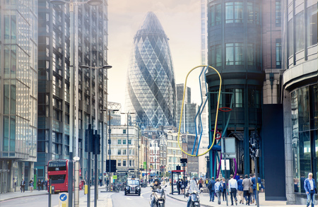 LONDON, UK - 17 may, 2016: City of London street with Gherkin building view, red double-decker buses and walking people.のeditorial素材