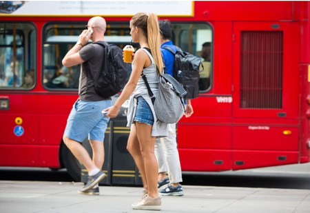London, UK - August 24, 2016: Young girls walking in Oxford street, the main destination of Londoners for shopping. Modern life conceptのeditorial素材