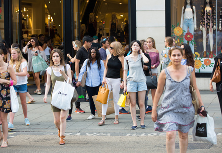 London, UK - August 24, 2016: Lots of people walking in Oxford street, the main destination of Londoners for shopping. Modern life conceptのeditorial素材