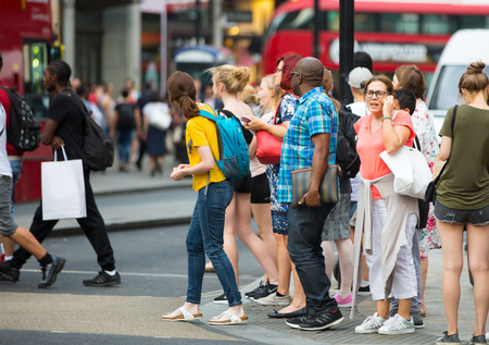 London, UK - August 24, 2016:  Lots of people crossing the Regent street at the traffic lights. Populated city conceptのeditorial素材