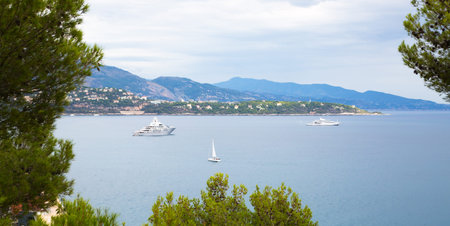 Monaco, Monte Carlo - September 16, 2016: Principality of Monaco. View of the seaport and the city of Monte Carlo with luxury yachts and sail boatsのeditorial素材