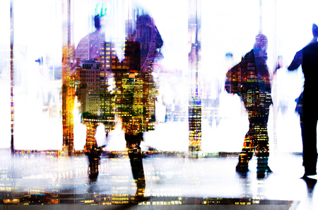Silhouettes of business people walking in entrance hall. Multiple exposure blurred image. Business concept illustration.の写真素材