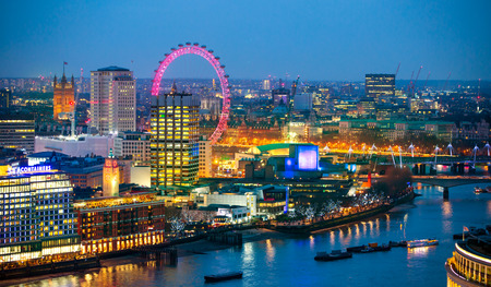 London, UK - December 19, 2015: London at sunset with lights and reflection. View at the Westminster aria, London eye, River Thames, embankment and London bridgeのeditorial素材