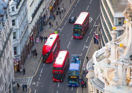 Aerial view of the City of London road with double decker buses and lots of office workers walking on the street.のeditorial素材
