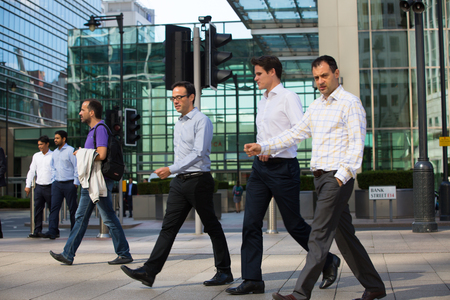 London, UK - 8 September, 2016: Business people walking on the Canary Wharf square, business and financial aria. Modern life conceptのeditorial素材