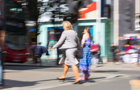 London, UK - 8 September, 2016: Business woman walking in Oxford street. Blurred image. Modern life conceptのeditorial素材