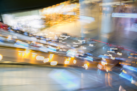 London, UK - November 30, 2016:  Multiple exposure image of underground station entrance with escalators in Canary Wharf.のeditorial素材