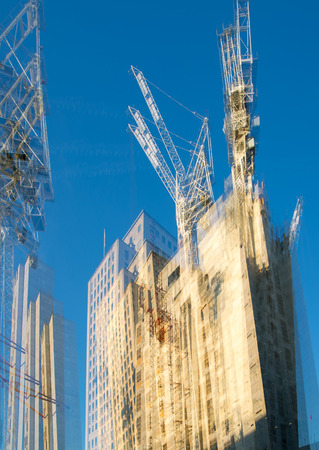 London, UK - November 30, 2016:  Building construction site in the centre of London, Lots of cranes and concrete contraction against of blue sky.のeditorial素材