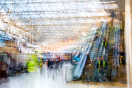 London, UK - November 30, 2016:  Multiple exposure image of lots of people walking and waiting for boarding in the Waterloo train station. Commuting rush hours concept, modern life.のeditorial素材