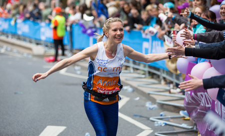 London, UK - April 23, 2017: Happy Marathon runner cheering by public. Charity money raise.のeditorial素材