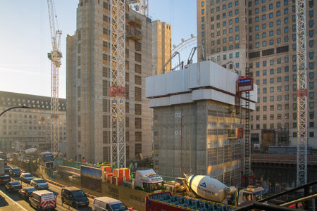 London, UK - November 30, 2016:  Building construction site in the centre of London. Crane, concrete...