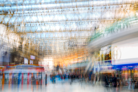 London, UK - November 30, 2016:  Multiple exposure image of lots of people walking and waiting for boarding in the Waterloo train station. Commuting rush hours concept, modern life.のeditorial素材