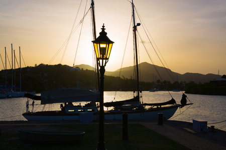 Blur image of Sailing boat and lantern against of sunset. Antiguaの写真素材