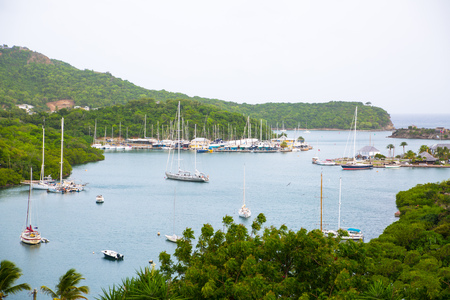 Antigua, Caribbean islands, English Harbour - May 20, 2017:  English harbour view with Freemanâs bay and yachts anchored by the beachのeditorial素材