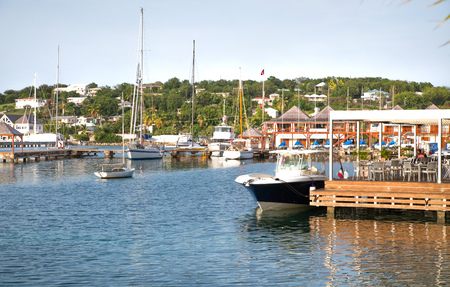 Antigua, Caribbean islands, English Harbour - May 20, 2017:  English harbour view with with cafe and boatのeditorial素材