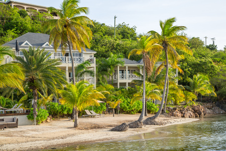Antigua, Caribbean islands, English Harbour - May 19, 2017: South Point Hotel at sunset, beach and palmsのeditorial素材