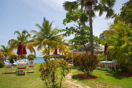 Antigua, Caribbean islands, English Harbour - May 20, 2017:  Galleon beach cafe, table and chairsのeditorial素材