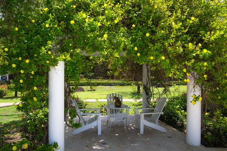 Antigua, Caribbean islands, English Harbour - May 20, 2017:  Galleon beach cafe, table and chairsのeditorial素材