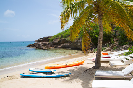 Antigua, Caribbean islands, English Harbour - May 20, 2017:  Galleon beach with beds and palmsのeditorial素材