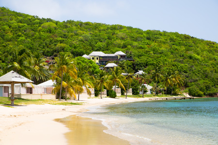 Antigua, Caribbean islands, English Harbour - May 20, 2017:  Galleon beach with holidays housesのeditorial素材