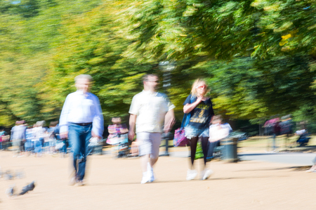 London, UK - September 8, 2016:  Blurred image of walking people in the parkのeditorial素材