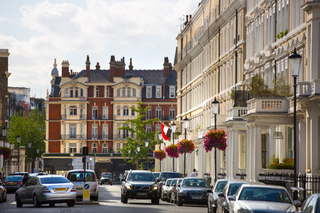 London, UK - September 8, 2016: Residential aria of Kensington with row of periodic buildings....