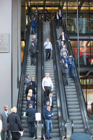 London, UK - March 15, 2017: City of London. Business people on the escalator.   Modern busy business life concept.のeditorial素材