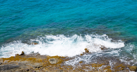 Tropical warm water of Caribbean sea and rocks. Antigua, Caribbean islandの写真素材