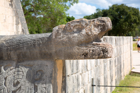 Mexico, Chichen Itzá, Yucatán. Sculpted snake head at the mayan ruins of  Kukulcan El Castillo