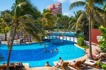 Mexico, Cancun - February 15, 2018: Grand Pyramid entertaining complex. Swimming pool and people relaxin by the water.のeditorial素材