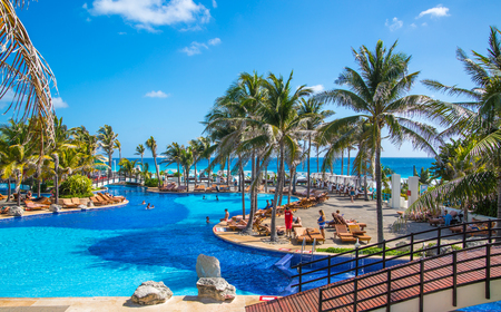 Mexico, Cancun - February 15, 2018: Grand Pyramid entertaining complex. Swimming pool and people relaxin by the water.のeditorial素材