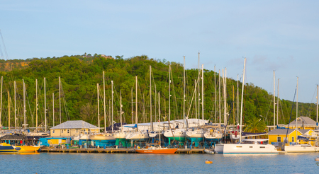 Antigua, Caribbean islands, English Harbour - May 20, 2017: English harbour view with Freeman's bay and yachts anchored by the beachのeditorial素材
