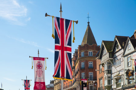 Windsor, UK - May 5, 2018: Hight Street of Windsor decorated with British flags due to the wedding...