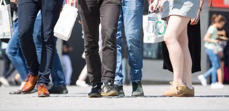 London, UK - 20 April, 2018: Feet of people walking in the City of London. Busy modern life concept.