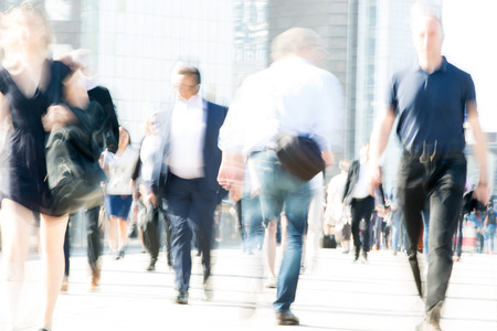 London, UK - April 19, 2018: Motion blur image of business people, who crossing the London bridge in early morning on the way to the City of London. Rush hoursのeditorial素材