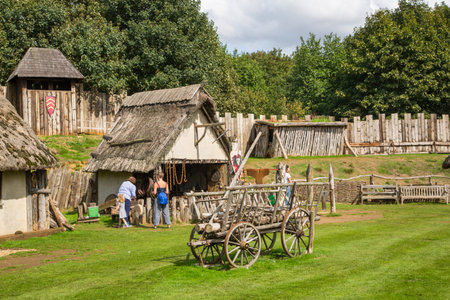 Essex, UK - 31 August, 2018: Main square in the Norman village reconstruction of 1050 AC, educational centre for kids with historical activities and every day medieval life experienceのeditorial素材
