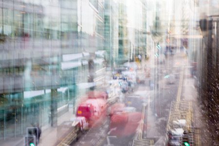 Canary Wharf, Bank street with taxis. Blurred image for background. London, UKのeditorial素材