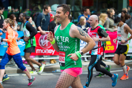 London, UK - April 23, 2017: Happy Marathon runner cheering by public. Charity money raise.のeditorial素材