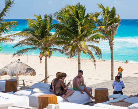 Mexico, Cancun - February 15, 2018: Ocean view and Cancun beach and lots of people resting  Grand Pyramid entertaining complex.のeditorial素材