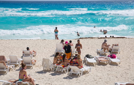 Mexico, Cancun - February 15, 2018:  People relaxing and sunbathing on the beach. Cancun   Grand Pyramid entertaining complexのeditorial素材