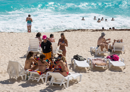 Mexico, Cancun - February 15, 2018:  People relaxing and sunbathing on the beach. Cancun   Grand Pyramid entertaining complexのeditorial素材