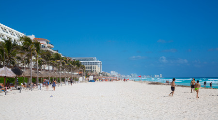 Mexico, Cancun - February 15, 2018:  People relaxing and sunbathing on the beach. Cancun   Grand Pyramid entertaining complexのeditorial素材