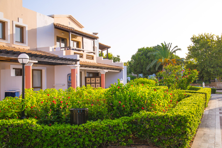 Hersonissos, Crete, Greece- July 17, 2018: The 5 stars Aldemar Knossos Royal Hotel with village-style layout of Royal villas, surrounded by beautiful garden and marble decorated pathsのeditorial素材