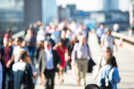 London, UK - April 19, 2018: Office workers crossing the London bridge in early morning on the way to the City of London, the leading business and financial area in Europe. Rush hoursのeditorial素材